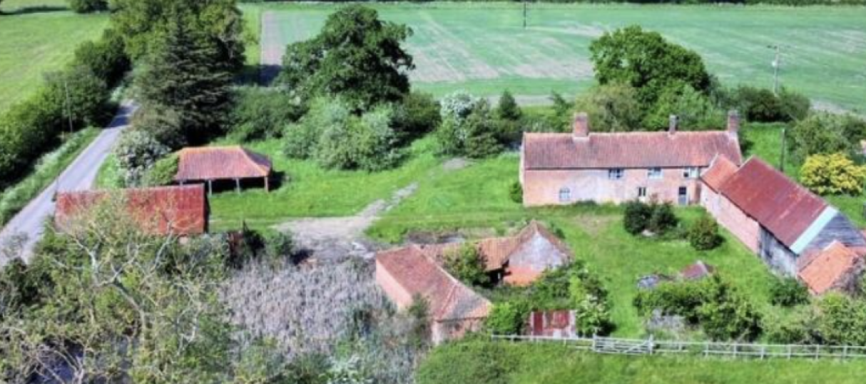 Farmhouse with outbuildings for sale